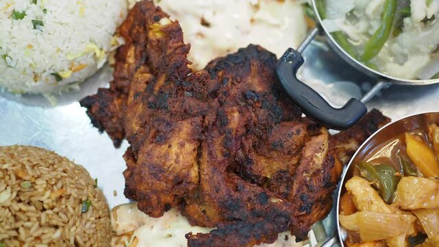 Delicious grilled chicken served with fresh vegetables and rice