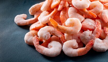 Raw frozen and peeled shrimp background Pile of frozen shrimps  Close up of frozen shrimps A lot of royal shrimp macro shot