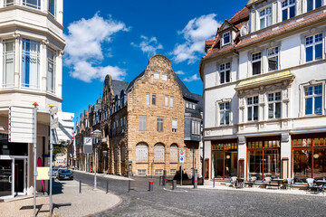 Historic town scape in Gotha, Thuringia, with sandstone building and charming cafes under blue summer skies