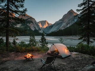 Minimalist campsite at twilight by a mountain river with a glowing campfire and a single tent