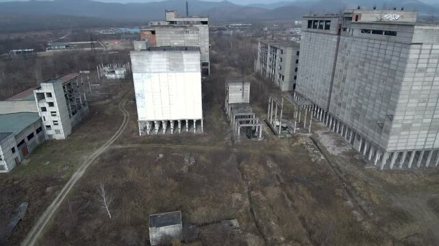 Abandoned Feed Mill Factory.  Drone view of a partially constructed Soviet feed production plant, frozen in time since the collapse of the USSR. 