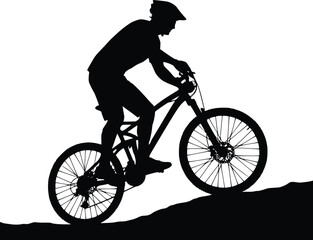 Fototapeta premium Silhouette of a cyclist riding uphill, emphasizing endurance and outdoor adventure