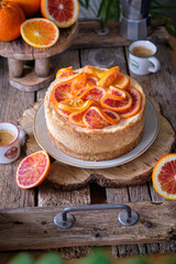 Blood Orange Cheesecake. Wooden background