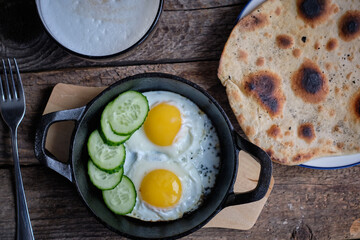 Breakfast, scrambled eggs, salad, sandwich, toast.