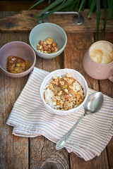 Rice pudding with caramelized apples. wooden background, side view