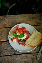 Breakfast. Cherry Tomato Basil Mozzarella Salad and toast