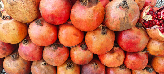 A pile of fresh pomegranate open sell in Indian market.
