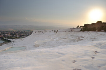Sunset over the white travertine terraces of Pamukkale, Turkey