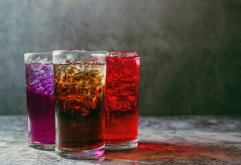 A lot of Soft drinks in colorful and flavorful glasses on the table,Glasses with sweet drinks with...