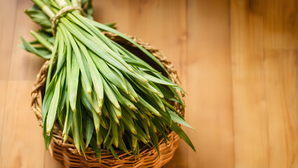 Fototapeta premium Freshly Harvested Lemongrass Stalks in a Basket