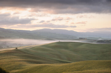 Ethereal sunrise over the misty hills of Tuscany - Val d’Orcia. italy
