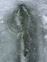 Crack in Frozen Lake Surface with Textured Ice Edges