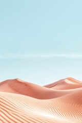 Beautifully shaped pink sand dunes undulate gently beneath a bright blue sky, capturing the serene beauty of this desert landscape during sunrise