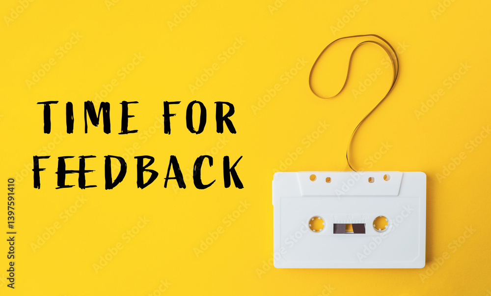 Poster white cassette tape is hanging from a string with a question mark on it
