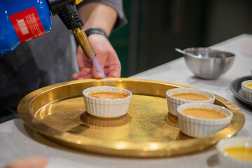 preparing creme brulee