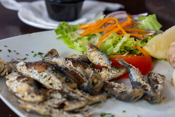 Fried sardines with salad in restaurant Canary islands Spain
