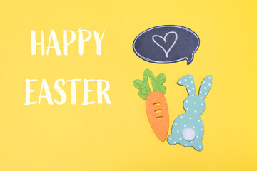 Yellow background with a carrot and a rabbit on it