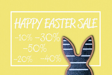 Fototapeta premium Sign for a happy Easter sale with a rabbit on it