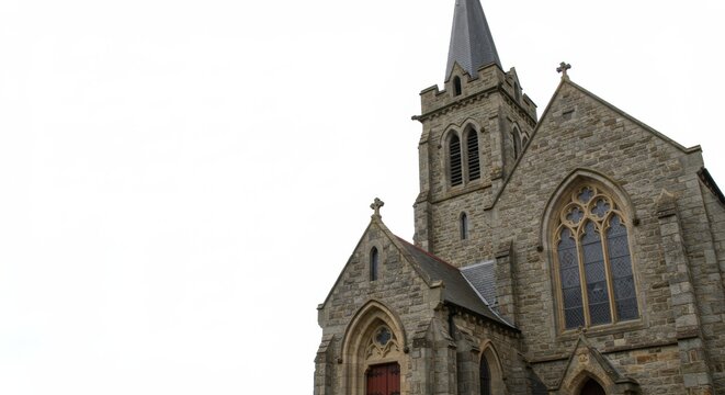 Elegant stone church steeple against stark white background, architecture design
