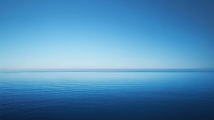 Obraz premium A smooth gradient blue background transitioning from deep navy at the edges to a bright sky blue at the center, creating a calming effect