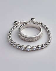A platinum ring and bracelet jewelry set in plain white background