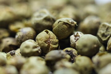 Close up of green peppercorns . Macro shot.