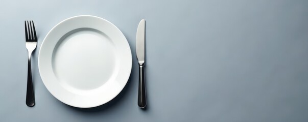 Empty plate, fork, knife on grey background  Top view , table setting, eating, fork
