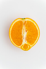 half orange on white background. fresh, juicy, raw, vegan vegetarian organic dessert - halved...