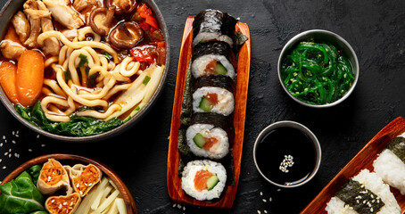 Traditional Japanese food dishes served on the table.