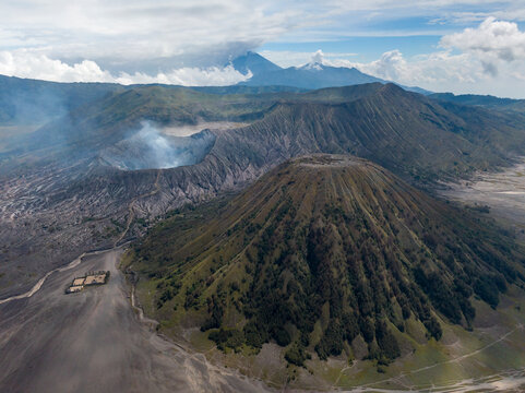 Aerial view of beautiful Bromo Tengger Semeru National Park with active volcano and smoke, Sukapura, Probolinggo, East Java, Indonesia.