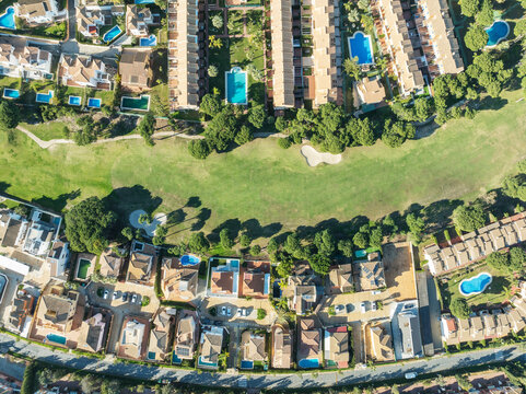 Aerial view of Islantilla Golf Resort with beautiful residential area, swimming pools, and lush greenery, Isla Cristina, Huelva, Spain.