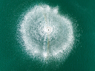 Aerial view of the serene La Noria Golf Resort with tranquil water splashes and dynamic patterns, Calahonda-Chaparral, Mijas, Malaga, Spain.