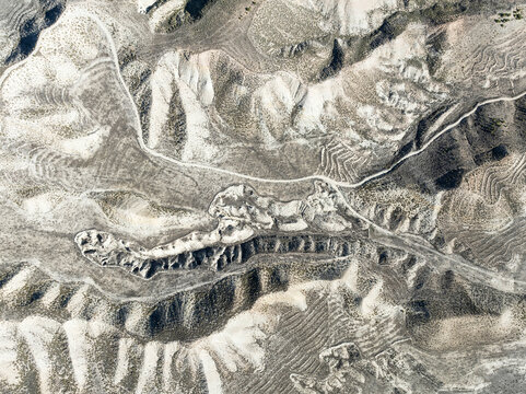 Aerial view of beautiful farmland with natural patterns and shapes in a mountainous landscape, Quesada, Jaen, Spain.