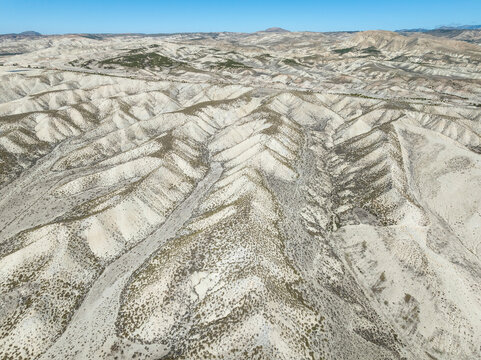 Aerial view of beautiful farmland with mountains and valleys, Dehesas de Guadix, Granada, Spain.