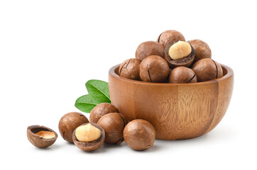 Macadamia nuts in wooden bowl isolated on white background.