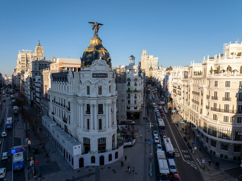 Madrid, Spain - 17 January 2025: Aerial view of bustling cityscape featuring the iconic Edificio Metropolis and vibrant traffic, Centro, Madrid, Spain.