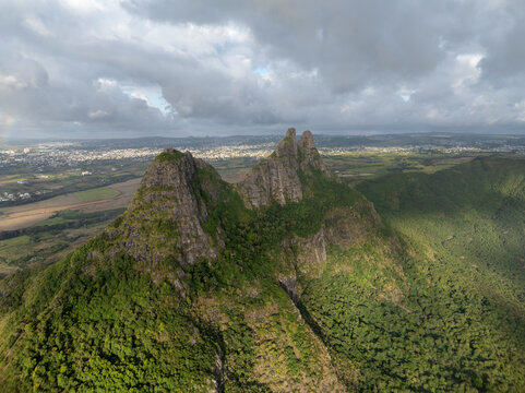 Aerial view of lush mountain landscape with greenery and cloudy sky, Vacoas-Phoenix, Riviere Noire, Mauritius.
