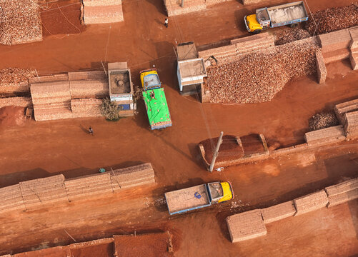 Aerial view of a busy brick factory with trucks and production activity, Dhaka, Dhaka, Bangladesh.
