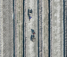 Aerial view of brick factory with workers and patterns of dust and lines, Dhaka, Dhaka, Bangladesh.