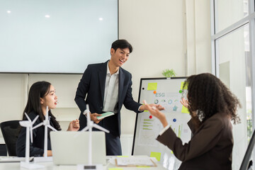 ESG Strategy and Team Collaboration. Professionals discussing sustainable practices in an engaging meeting.