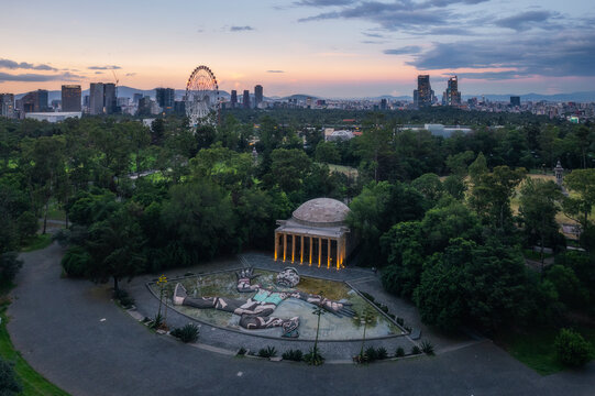 Aerial view of tlaloc fountain and ferris wheel in beautiful sunset over the urban landscape of Chapultepec Park, Miguel Hidalgo, Mexico City, Mexico.