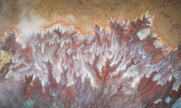 Aerial view of painted desert badlands with beautiful patterns and textures, Holbrook, Arizona, United States.