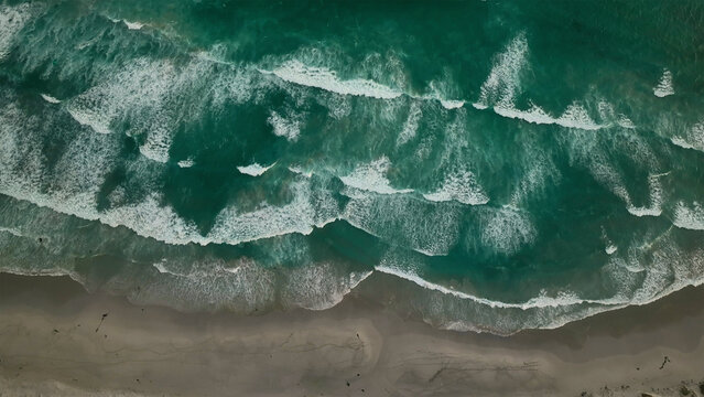 Aerial view of abstract coastal waves and beautiful beach pattern, Misty Cliffs, Scarborough, Western Cape, South Africa.