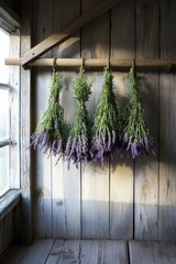 Hanging lavender bundles create serene atmosphere in rustic wood