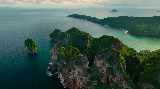 Aerial view of picturesque Phi Phi Island with lush vegetation, dramatic cliffs, and serene waters of the Indian Ocean, Krabi, Thailand.