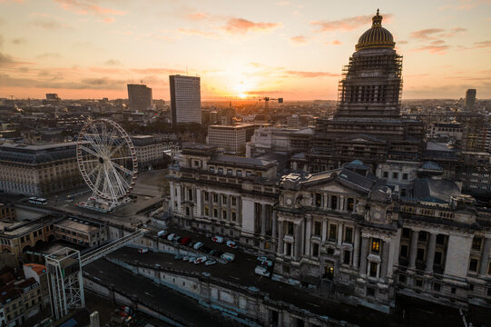 Aerial view of the Palace of Justice and Poelaert Place Ferris Wheel at sunset with a beautiful skyline, Sablon, Brussels-Capital, Belgium.