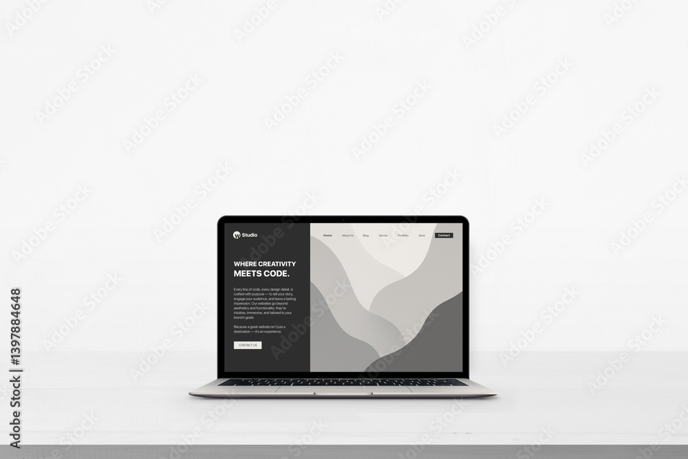 Poster Laptop on clean white desk with minimal conceptual website displayed, reading 'Where creativity meets code', ideal for showcasing design-meets-tech branding