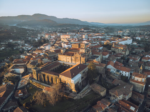 Aerial view of catedral de santa maria de tui and historic tui old town with beautiful rooftops and medieval architecture, Tui, Pontevedra, Spain.