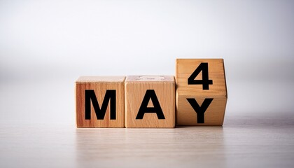 Naklejka premium Minimalist photo of wooden blocks with date 4 May. Day and month, calendar on white background