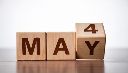 Minimalist photo of wooden blocks with date 4 May. Day and month, calendar on white background